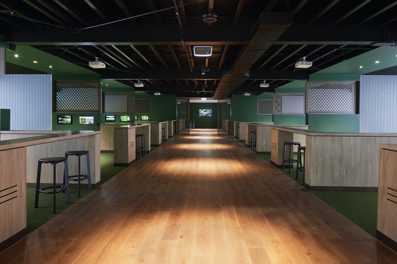 Rows of simulator bays along the GolfSpace floor